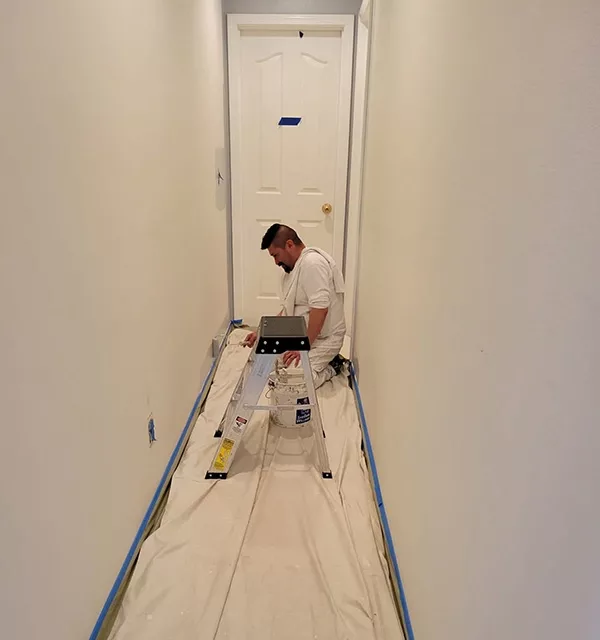 jk-paint-and-contracting-crew-member-painting-interior-hallway