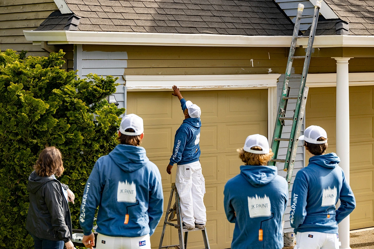 JK Paint & contracting painting crew painting a house