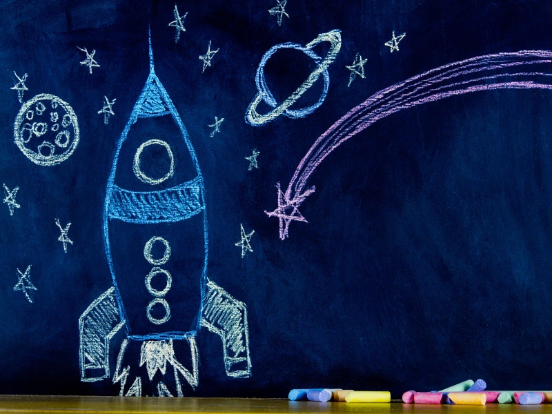 chalk-paint-painted-on-wall-with-chalk-rocketship-drawn-over-paint