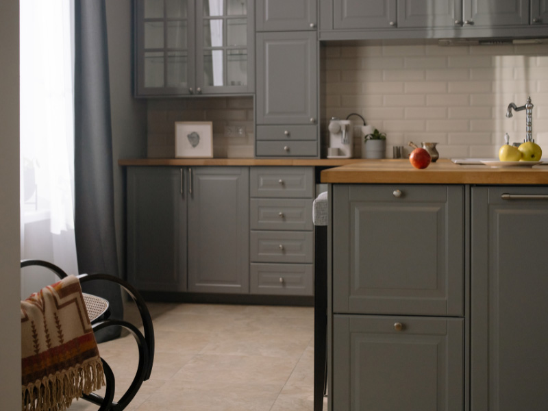 dark-gray-cabinets-in-contemporary-kitchen-with-wooden-board-countertops