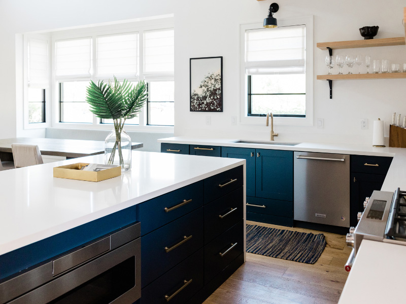 white-kitchen-with-dark-teal-blue-cabinets