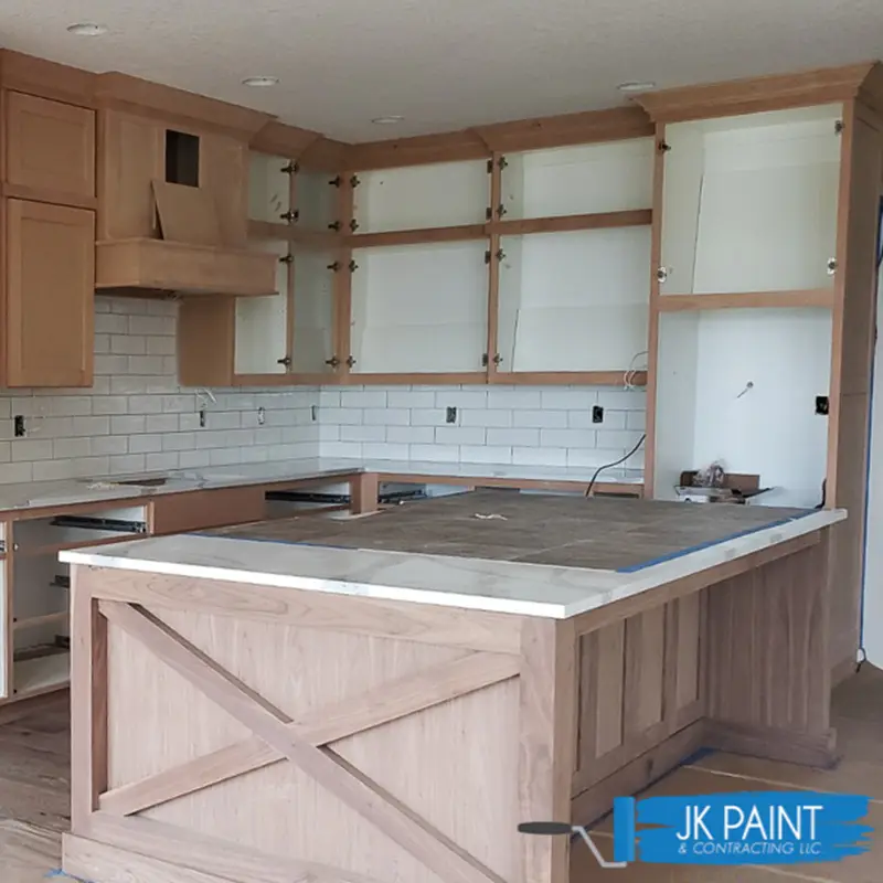 emptied-kitchen-with-cabinets-being-prepped-to-be-painted