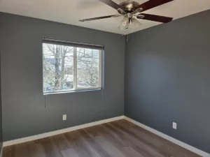 interior-painting-portland-area-portfolio-jk-paint-15 an exterior painting contractor caulking a house