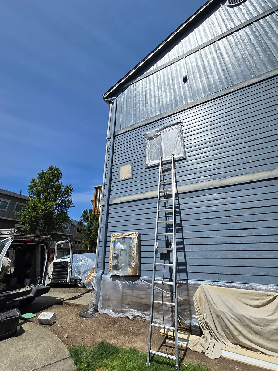 jk-paint-hoa-painting-portland-area-6 an hoa building being painted blue in tualatin