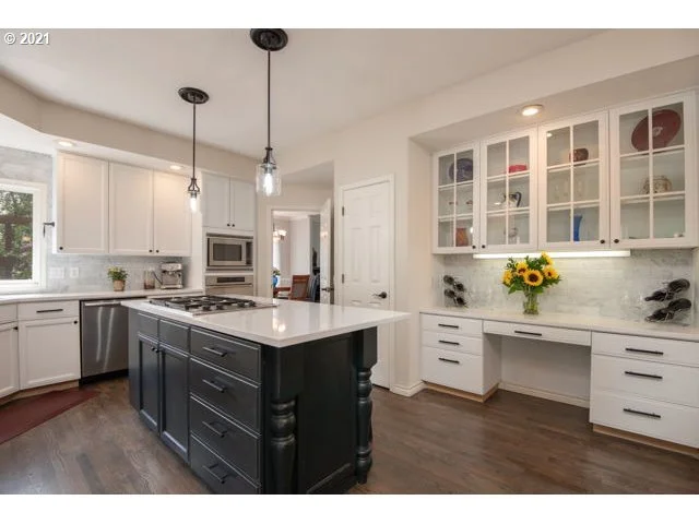photo of a kitchen with old and worn out cabinets