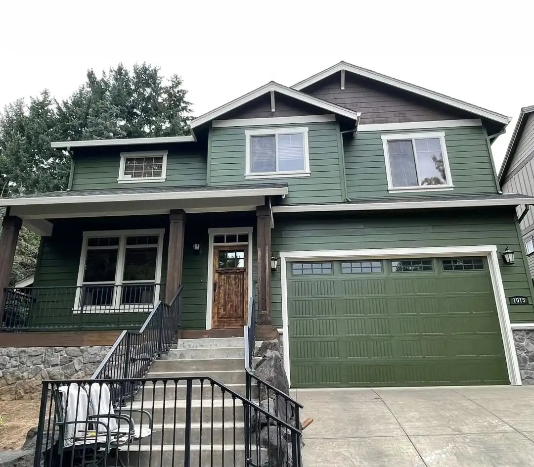 an after photo of a home in newberg after getting a paint job from JK Paint. house painted with green and brown Sherwin Williams paint