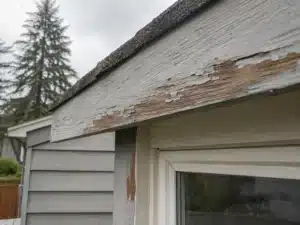 bare-wood-exposed-on-exterior-house-trim an exterior painting contractor caulking a house