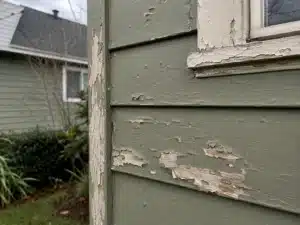 peeling-and-flaking-exterior-house-paint an exterior painting contractor caulking a house